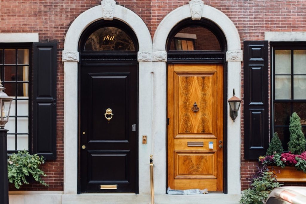 side by side of two front doors