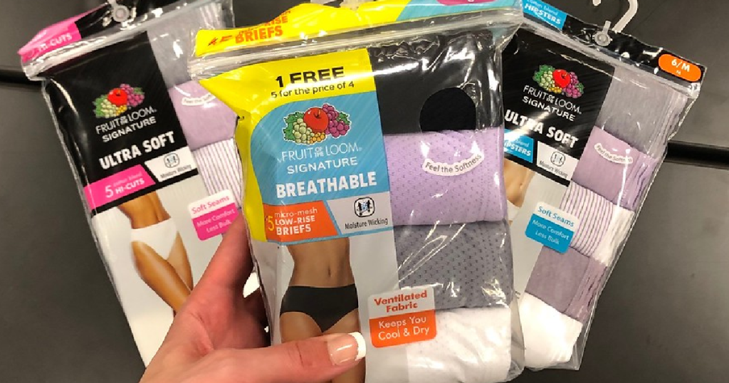 hand holding 3 packs of women's underwear