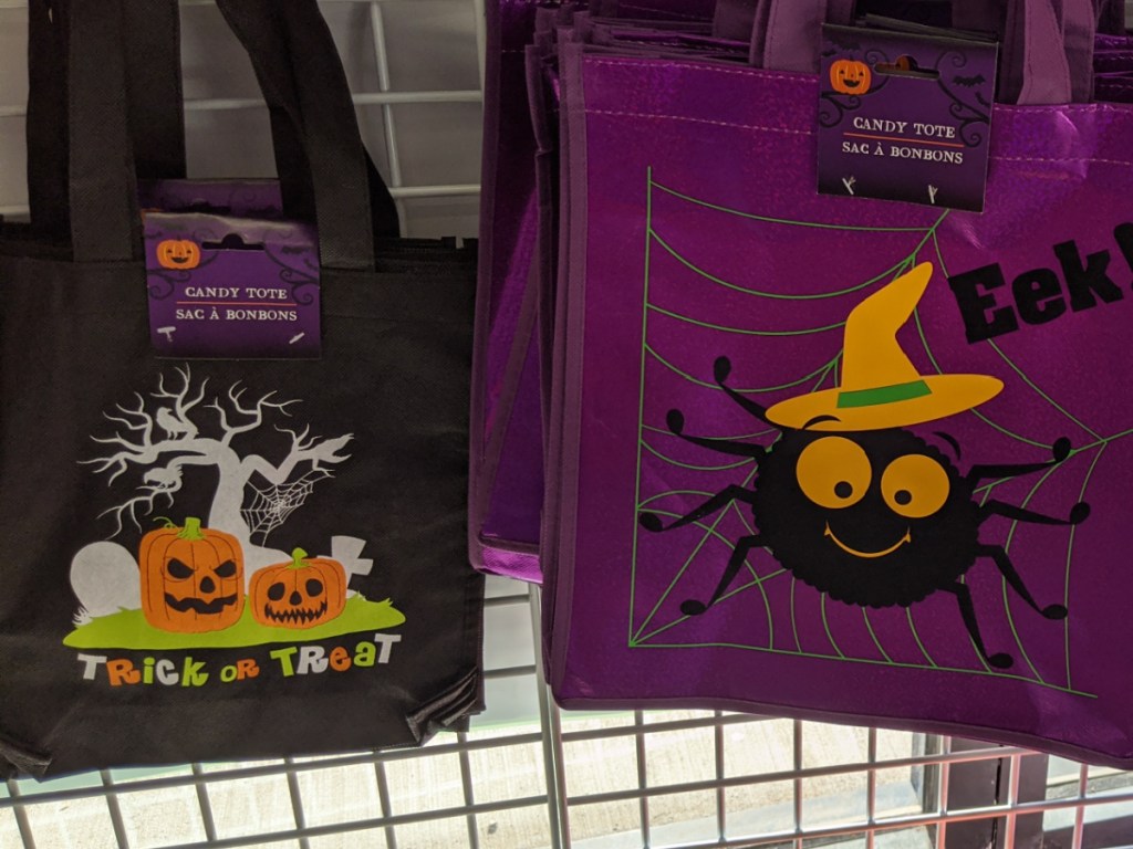 store shelf with halloween tote bags on it