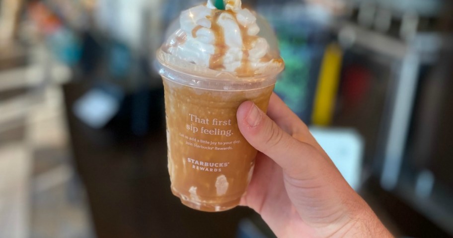 hand holding a Starbucks drink