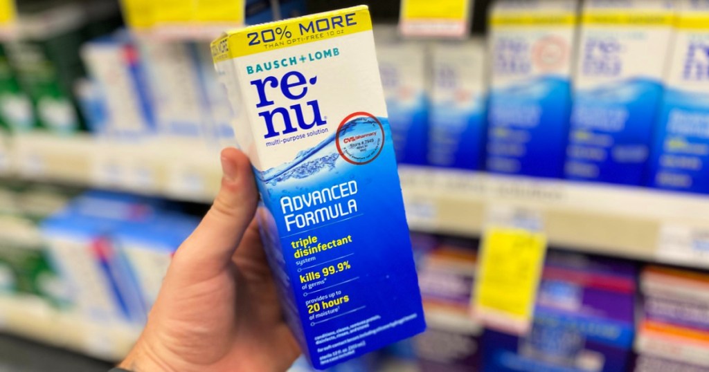 man holding bottle of renu contact solution