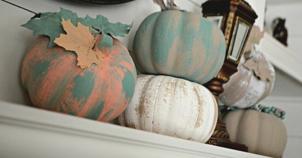 painted pumpkins on mantle