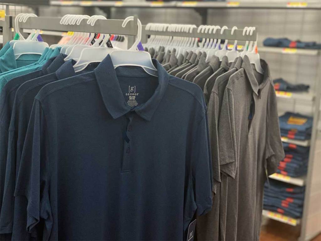 men's polo shirts on display in store