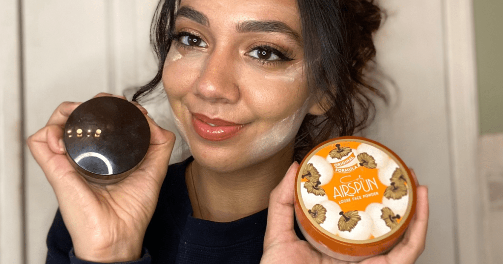 woman holding up powders 