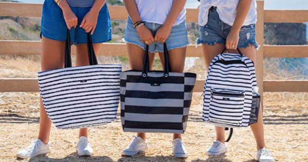 women holding scout bags outside