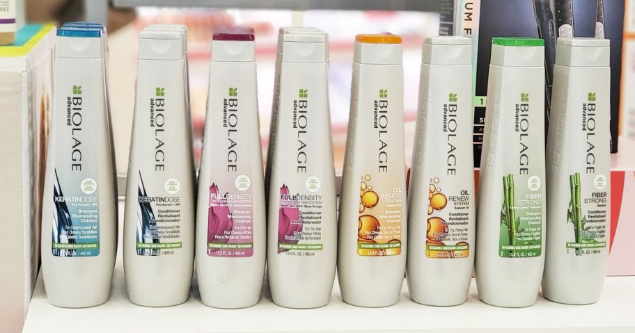 bottles of matrix biolage shampoo and conditioners on white table