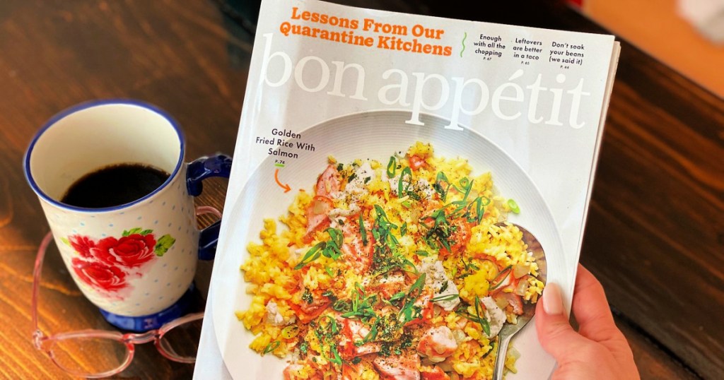 Bon Appétit Magazine in woman's hand with cup of coffee and reading glasses