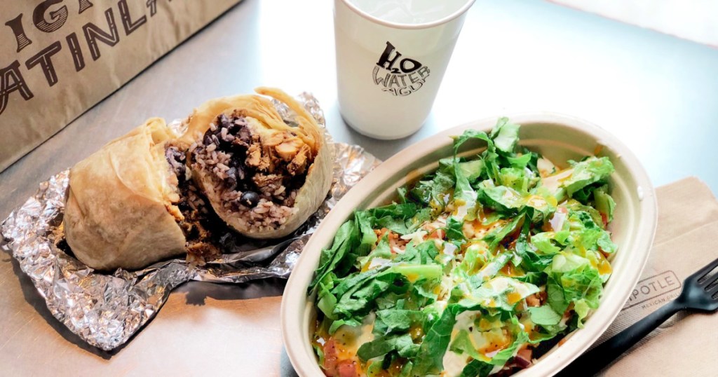 Chipotle entrees on table with cup of water