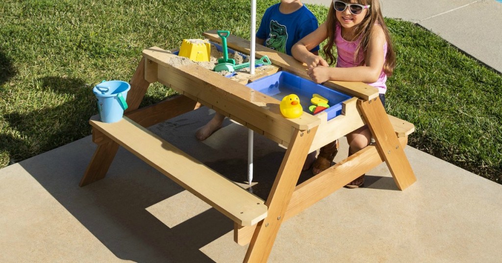 kids sitting at a Convertible Play Table