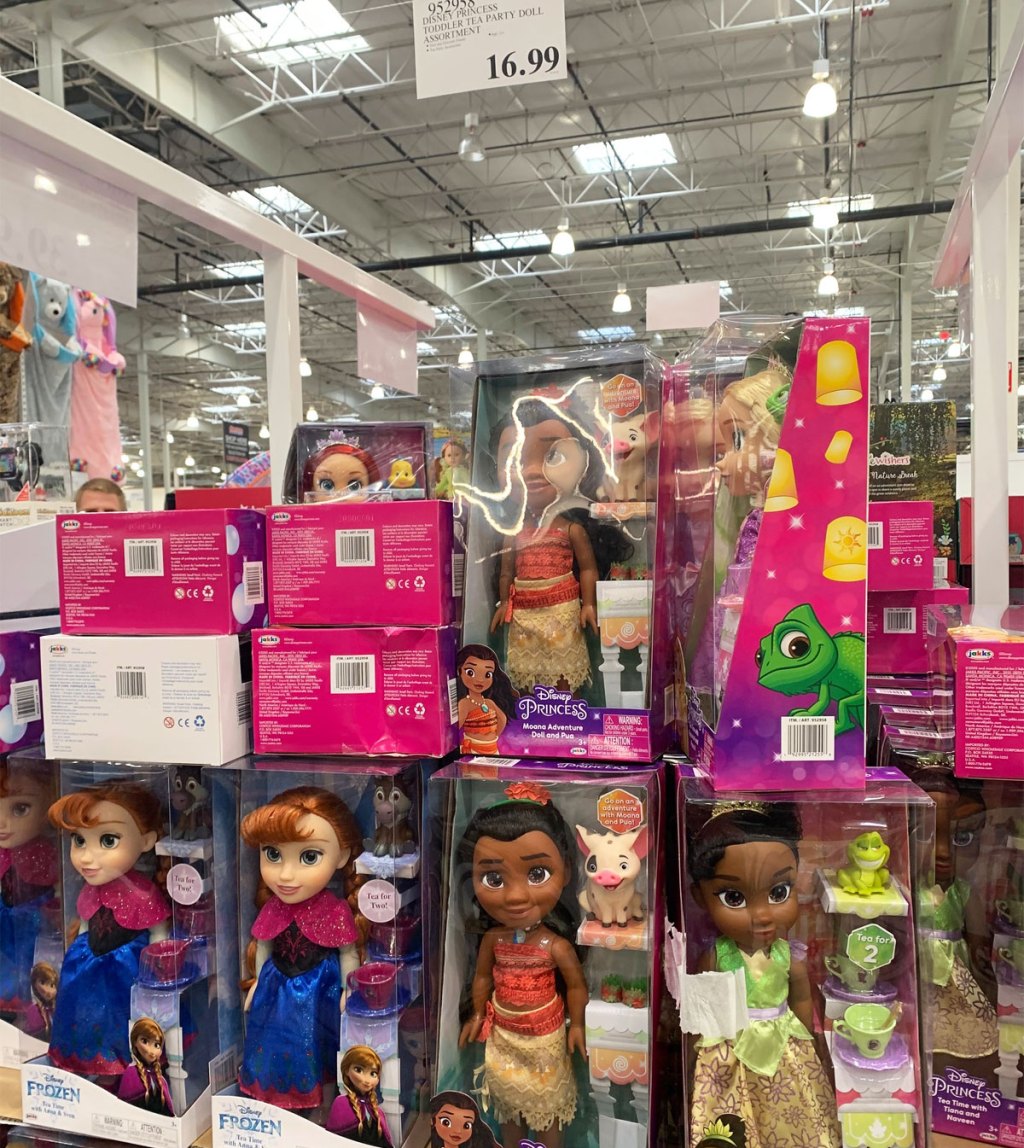 Disney princess dolls stacked on a Costco display