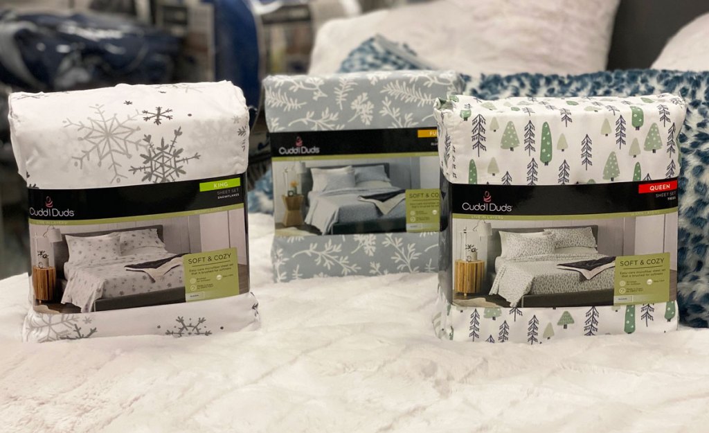 three sheet sets in christmas and winter prints on a white bed