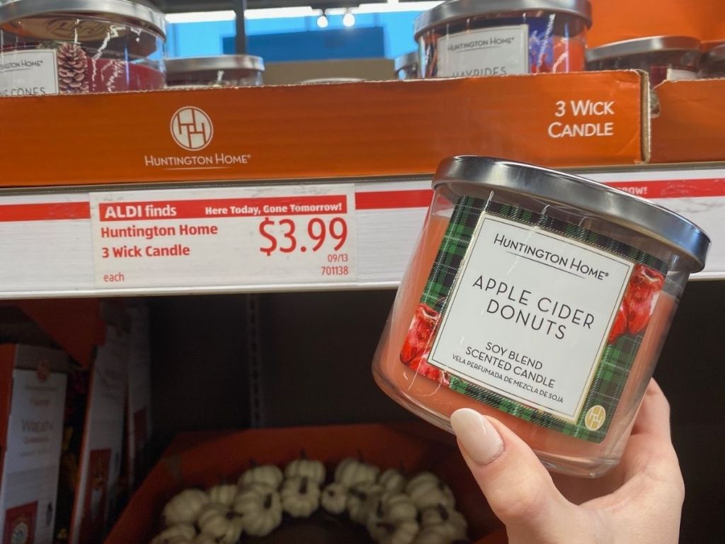 hand holding Apple Cider Donuts in store