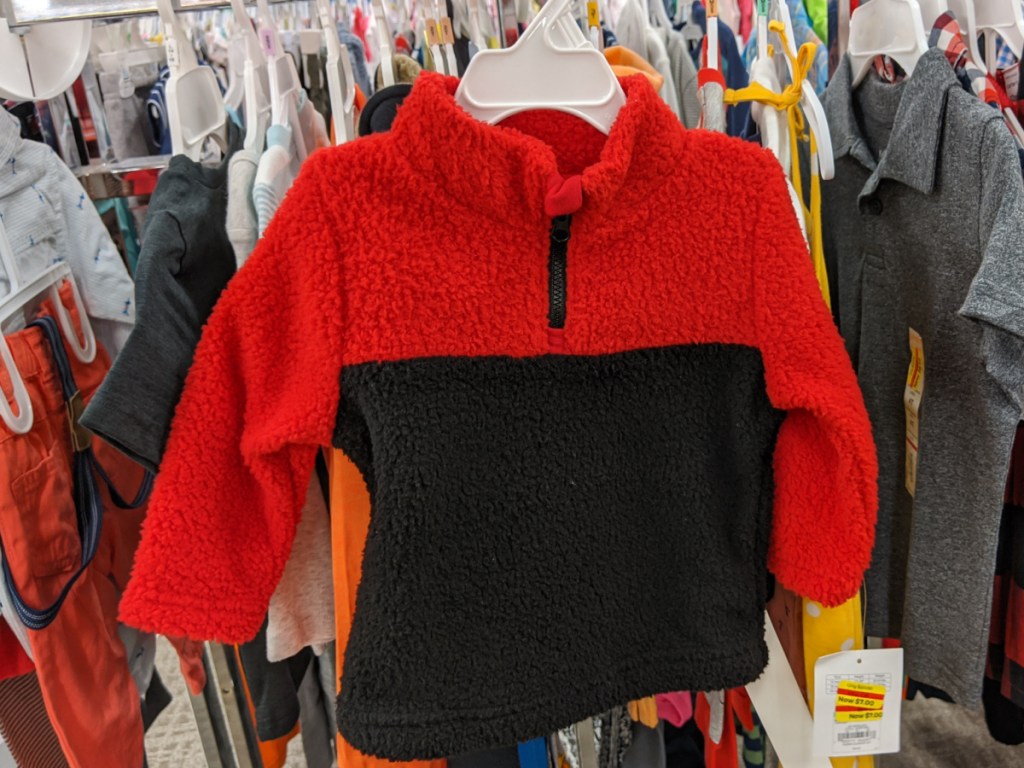 baby boy red and black sweater in hanging store