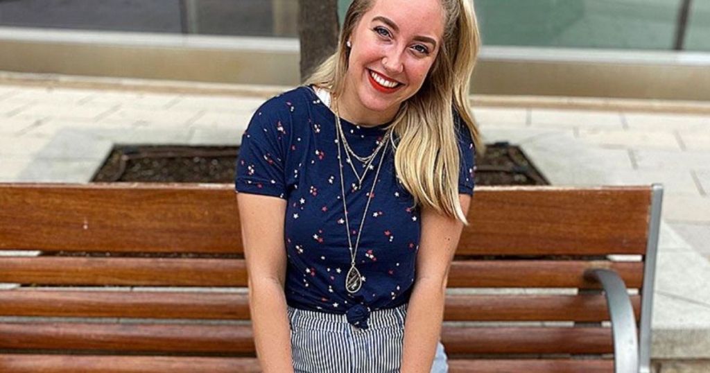 woman sitting on a bench smiling