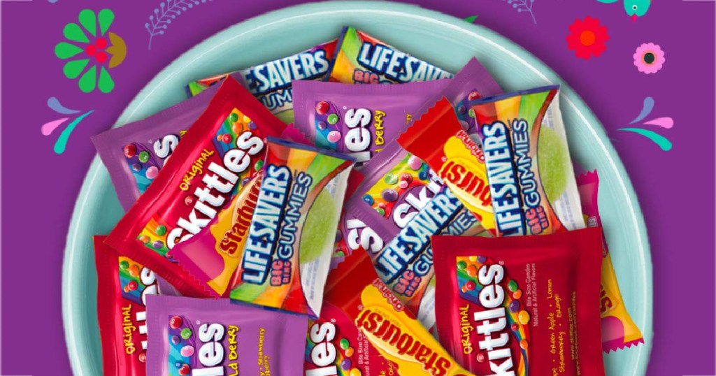 bowl of fun size candy and purple background