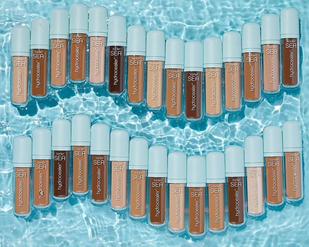 Tarte Hydrocealer Concealers in a line with water in the background