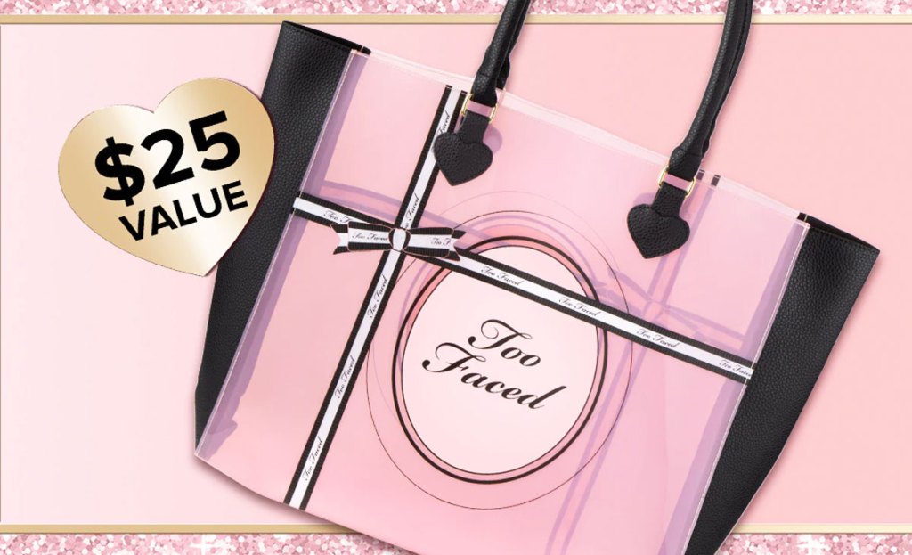 pink and black tote bag that says too faced on it