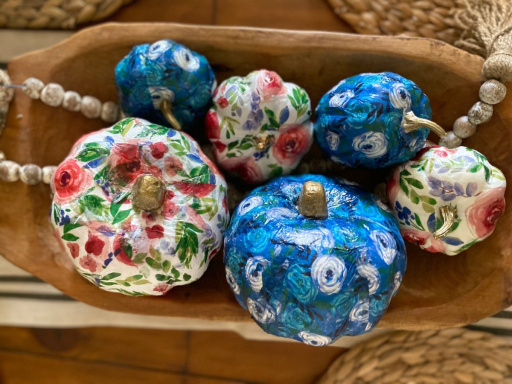 bowl with dollar tree tissue paper pumpkins on a table