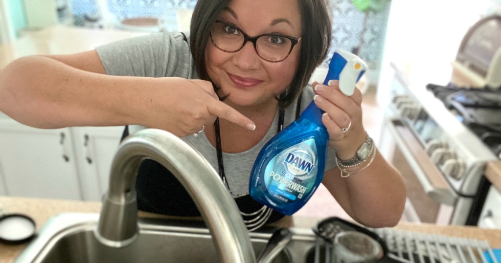 woman holding Dawn powerwash dish spray