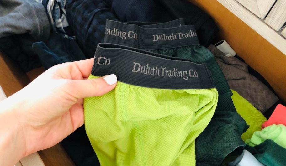 hand holding a pair of duluth trading onlinepany mens underwear