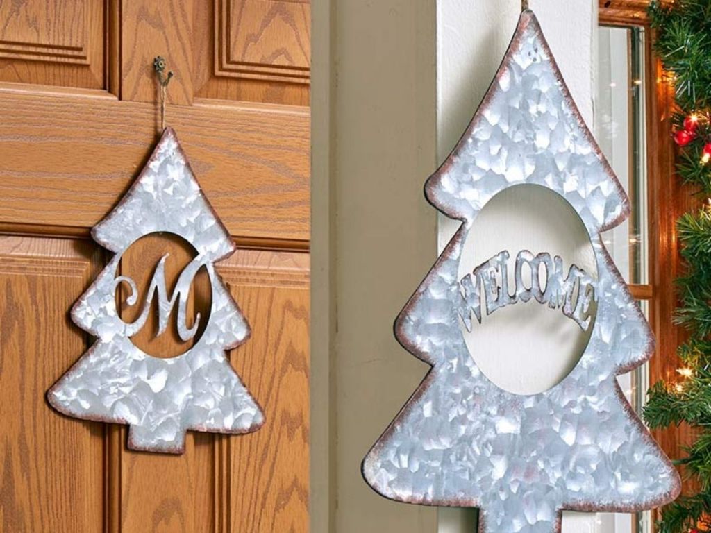 galvanized tree sign with monogram or welonlinee in the center 