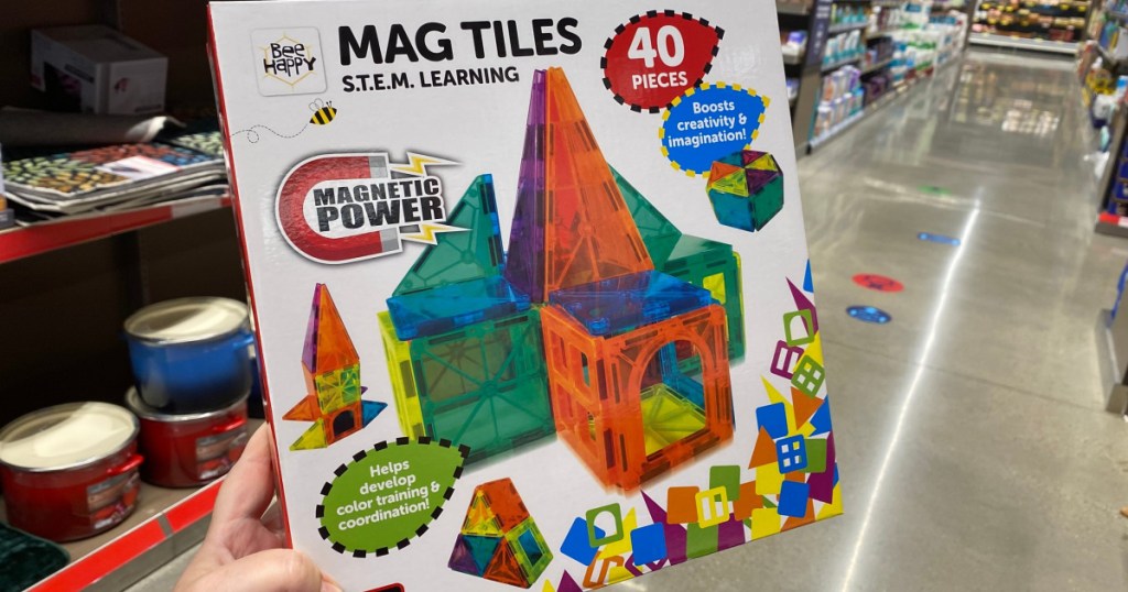 mag tiles at ALDI in hand in aisle