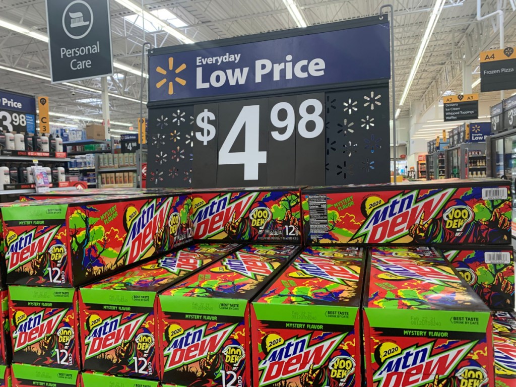 store display with price sign and cases of soda stacked up