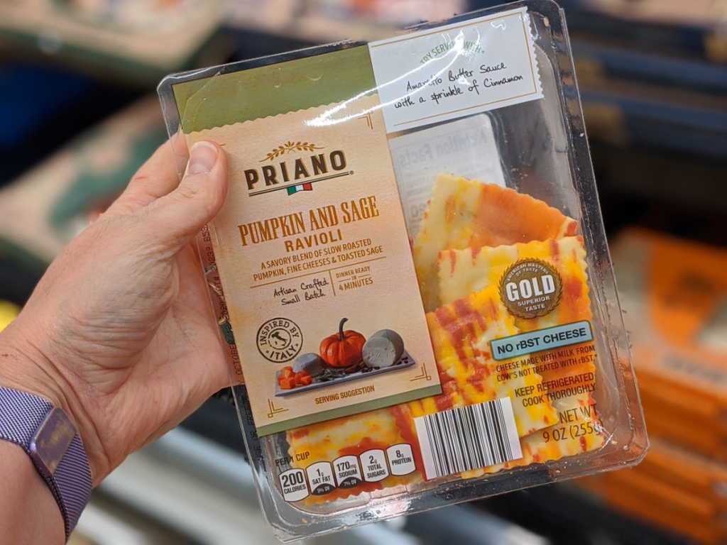 hand holding package of fresh ravioli in store