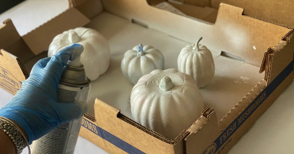 spray painting dollar tree craft pumpkins