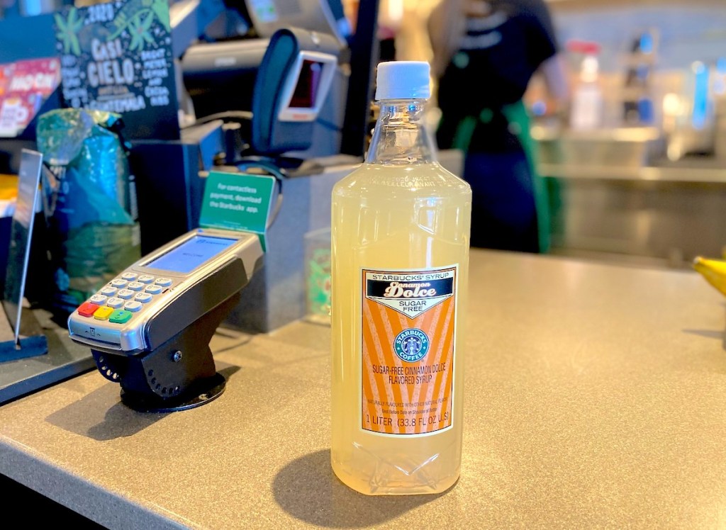 starbucks syrup sitting on checkout counter