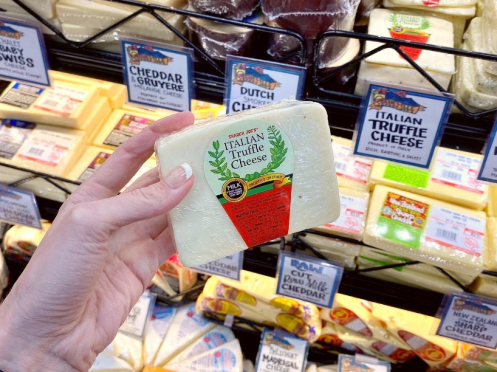 holding Italian truffle cheese at Trader Joe's