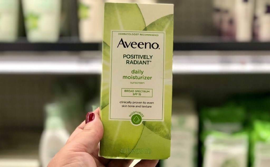 hand holding facial moisturizer in store