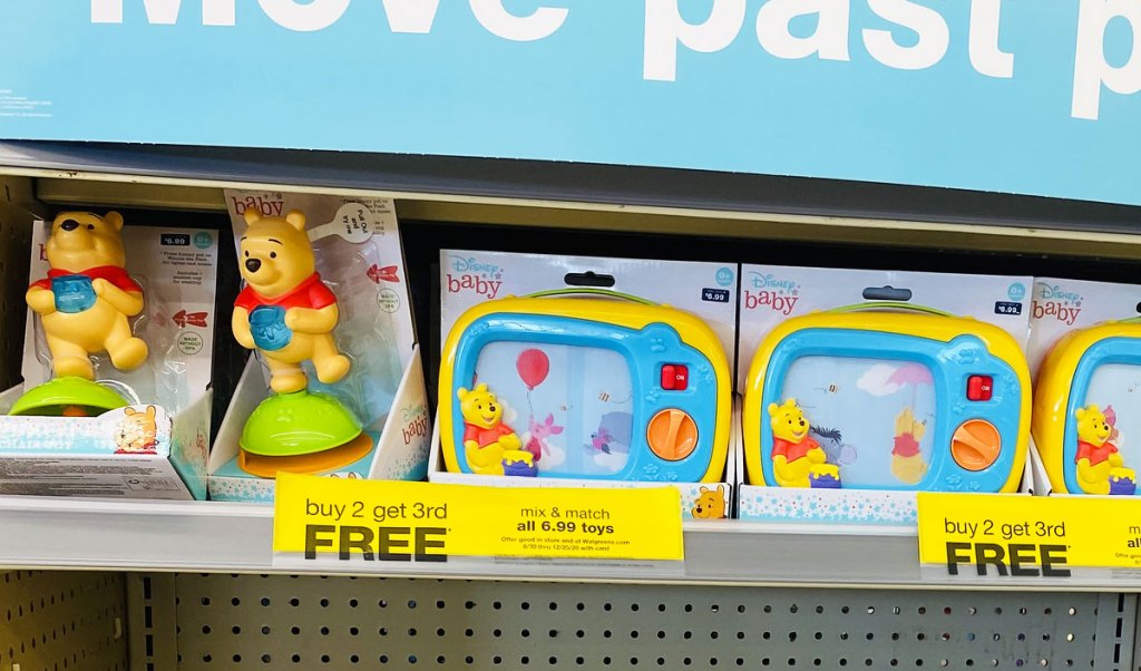 disney baby toys on walgreen shelf with yellow buy 2 get 3rd free sale sign