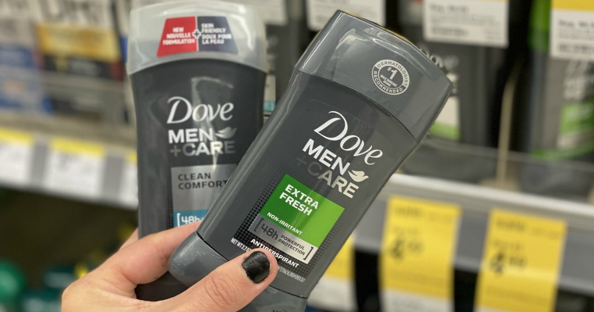 hand holding two Dove Men Care Deodorants in store