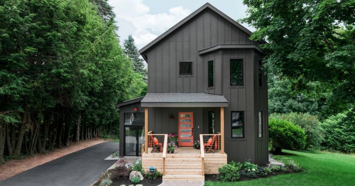 brown oasis house with wood front porch