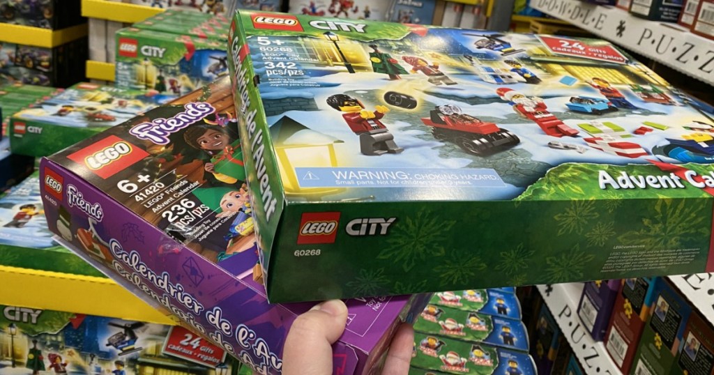 Hand holding up LEGO Advent Calendars at Costco