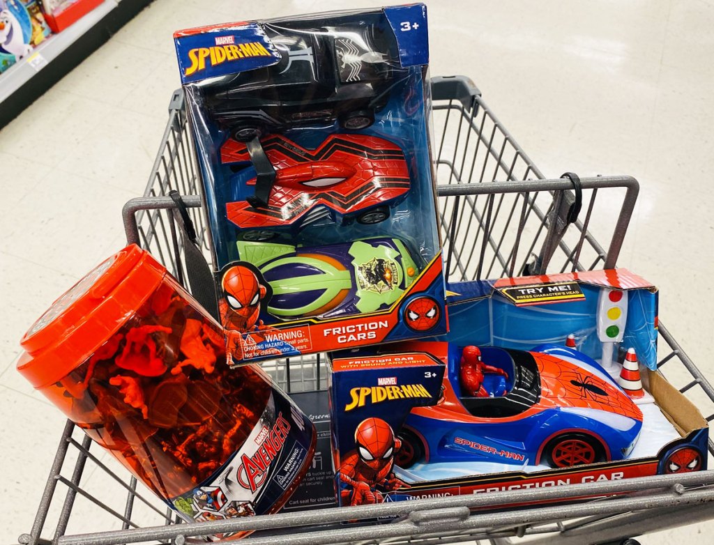 three marvel avengers and spider-man toys inside walgreens shopping cart