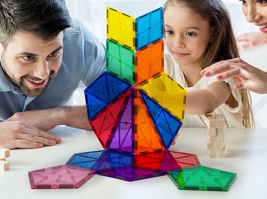 man and girl playing with 16-piece magnetic building block set