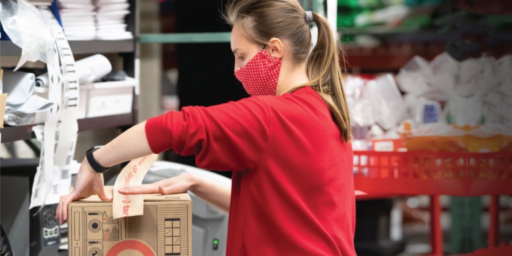 woman boxing merchandise at Target