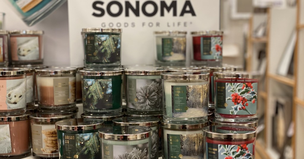 various scented jar candles stacked on table in store