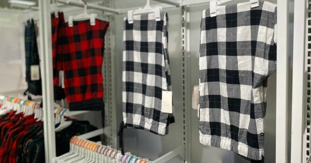 plaid pj pants hanging on a store wall display