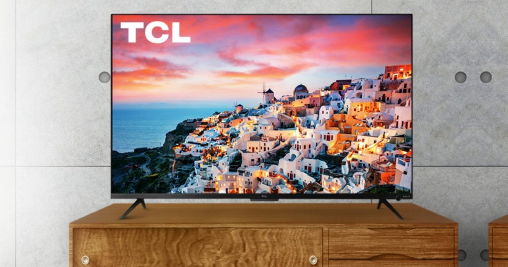 tcl tv on a wood tv stand