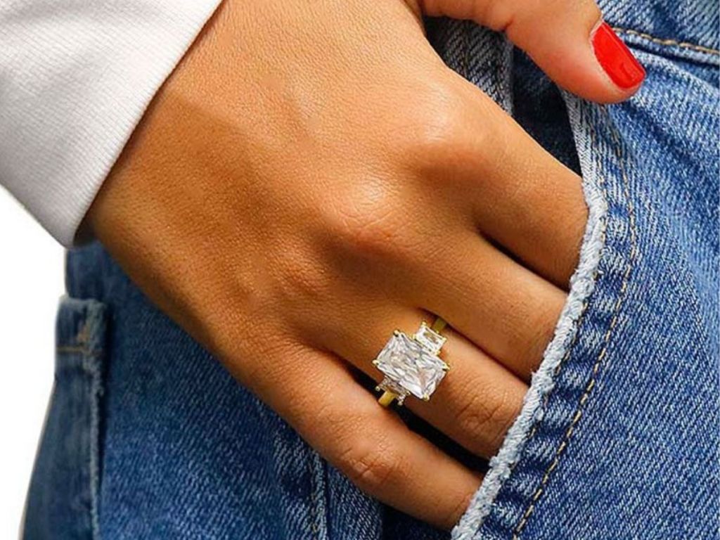 women's three stone square cut swarovski crystal ring on woman's hand