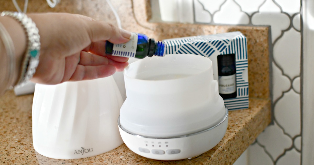 adding volcano essential oil to diffuser