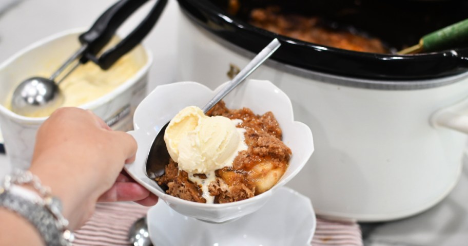 bowl of slow cooker apple dump cake (1)