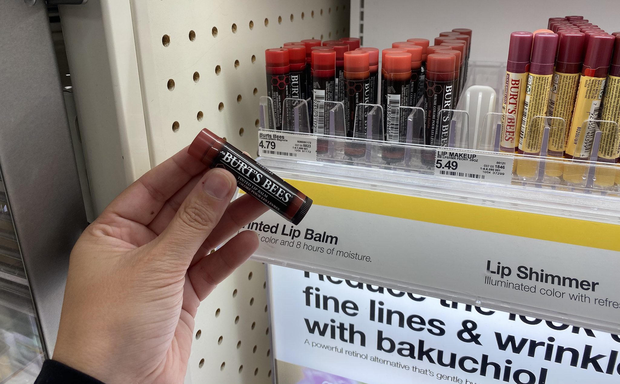 burt's bees tinted lip balm in hand in store