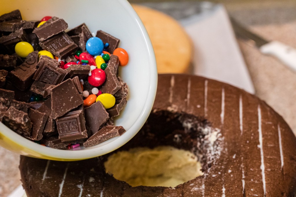 pouring candy in cake