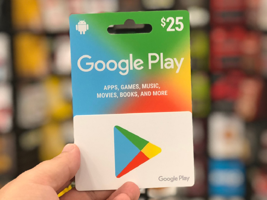 hand holding up gift card for Google Play