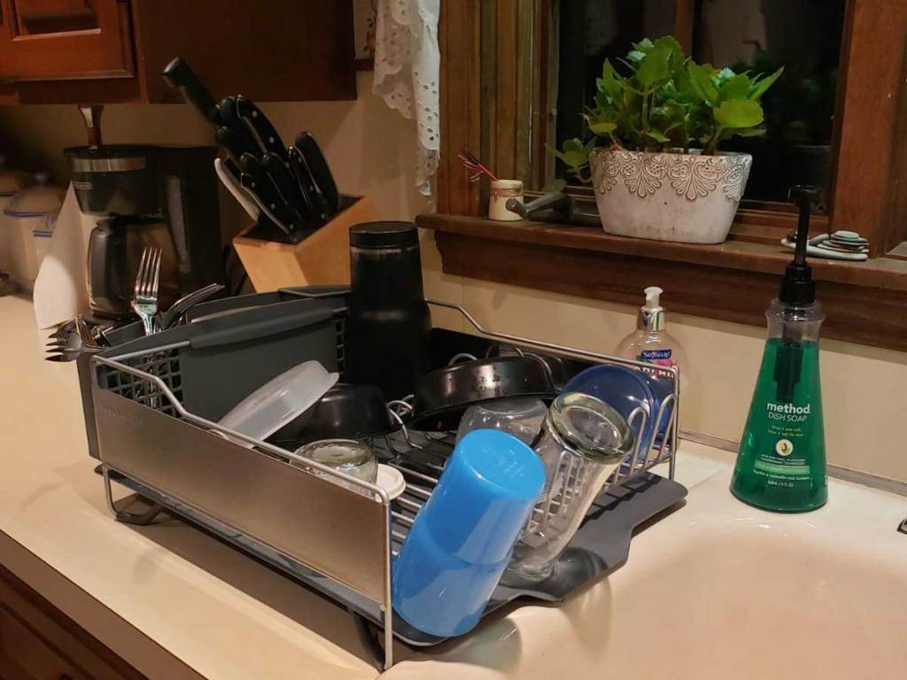 drying rack full of dishes on counter