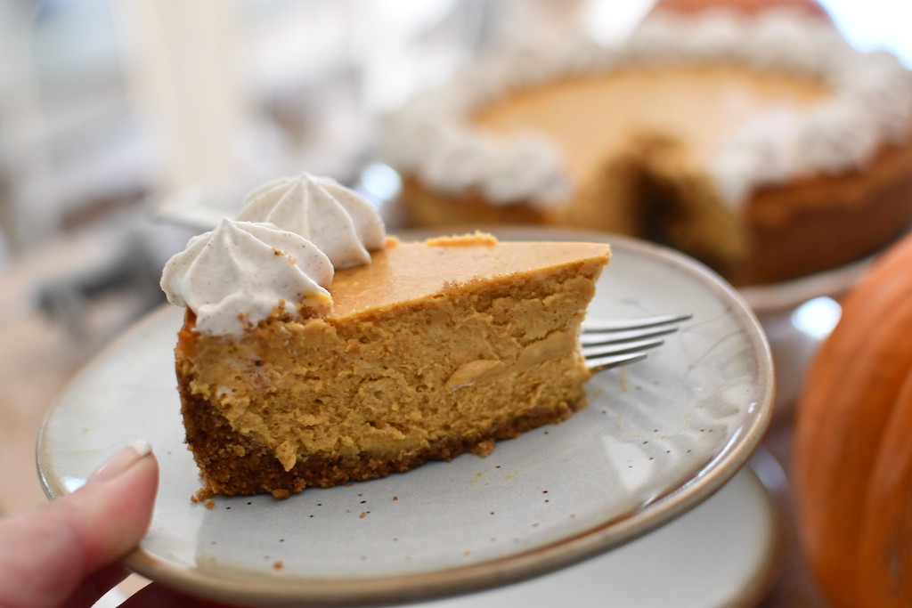 Pumpkin spice cheesecake slice on plate 